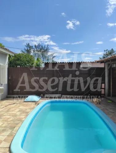 Ótima casa à venda em Tramandaí/RS - 3 dormitórios, piscina e 2 vagas